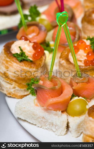 delicious seafood canapes with salmon and red caviar. seafood canapes