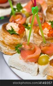 delicious seafood canapes with salmon and red caviar. seafood canapes