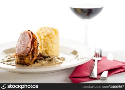 Delicious sirloin steak with mushroom and mashed potatoes and red wine