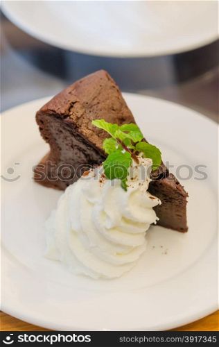 Delicious soft Chocolate Cake with whipped cream. chocolate cake