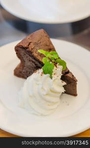 Delicious soft Chocolate Cake with whipped cream. chocolate cake