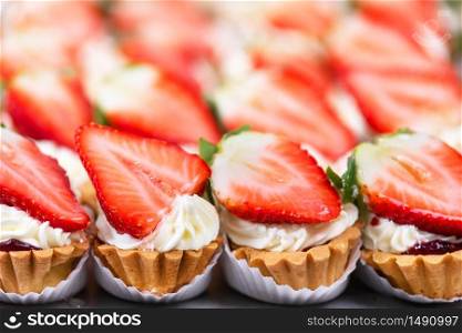 Delicious strawberries cheesecakes tartlets with fresh strawberries .. Delicious strawberries cheesecakes tartlets with fresh strawberries.