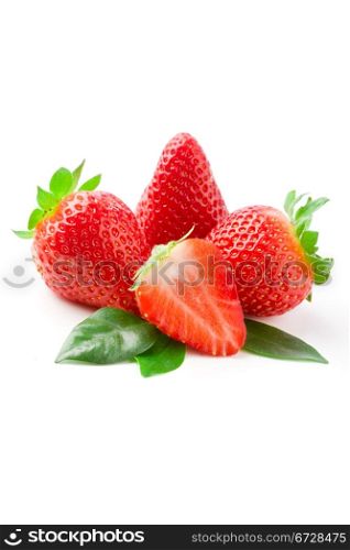 delicious strawberries on green leaves on white isolated background