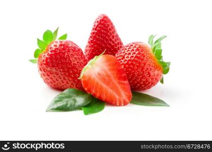 delicious strawberries on green leaves on white isolated background