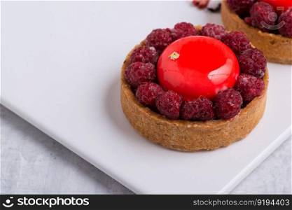 delicious strawberry cake on a white plate. sweets on white background