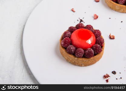 delicious strawberry cake on a white plate. sweets on white background