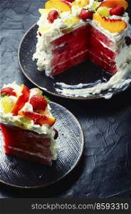 Delicious summer watermelon pie with fruit and whipped cream.. Colorful symbolic cake with watermelon and berries.