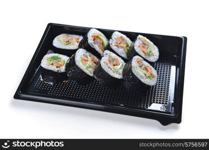 Delicious sushi rolls on black background