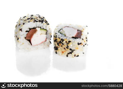 Delicious sushi rolls on white background