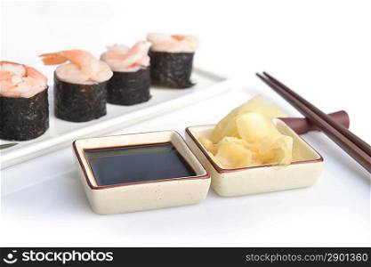 Delicious sushi rolls on white plate
