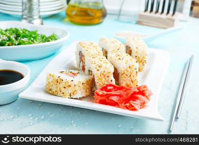 Delicious sushi rolls with rice, chuka and sauce