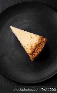 Delicious sweet cheesecake cake on textured concrete background. Delicious breakfast dessert