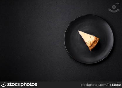 Delicious sweet cheesecake cake on textured concrete background. Delicious breakfast dessert