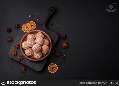 Delicious sweet round gingerbread with jam inside on a dark concrete background