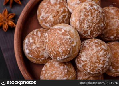 Delicious sweet round gingerbread with jam inside on a dark concrete background