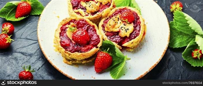 Delicious tartlets with berry jam.Cake with strawberries.Long banner. Summer biscuit with strawberries