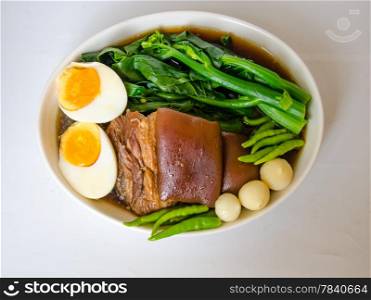 delicious Thai food call KHA MOO from stewed pork leg and vegetable with egg