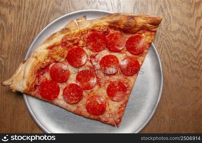 Delicious tomato sauce cheese covered hot and tasty pepperoni pizza pie . Pizza and Beer 