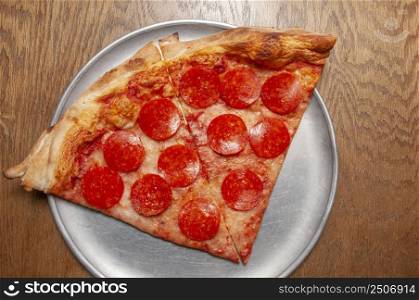 Delicious tomato sauce cheese covered hot and tasty pepperoni pizza pie . Pizza and Beer 