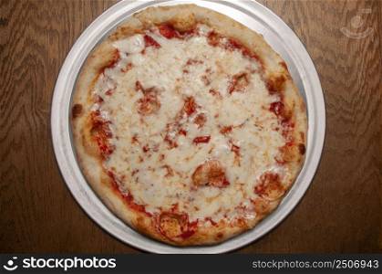 Delicious tomato sauce cheese covered hot and tasty pizza pie . Pizza and Beer