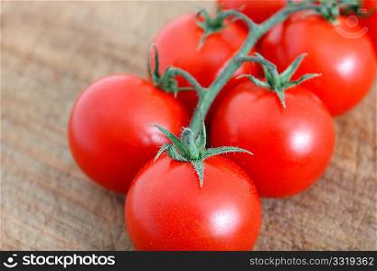 Delicious tomatoes on a chopping board