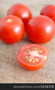 Delicious tomatoes on a chopping board