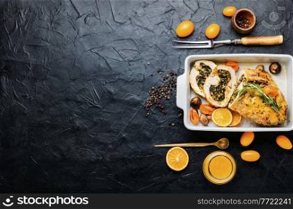 Delicious turkey breast roll stuffed herbs with citrus sauce. Space for text. Turkey roll with kumquat and orange,copy space