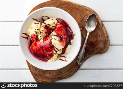 delicious vanilla ice cream with raspberry sauce and choco stripes