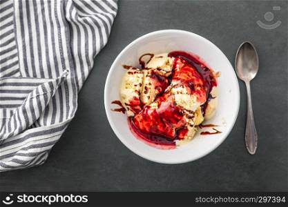delicious vanilla ice cream with raspberry sauce and choco stripes