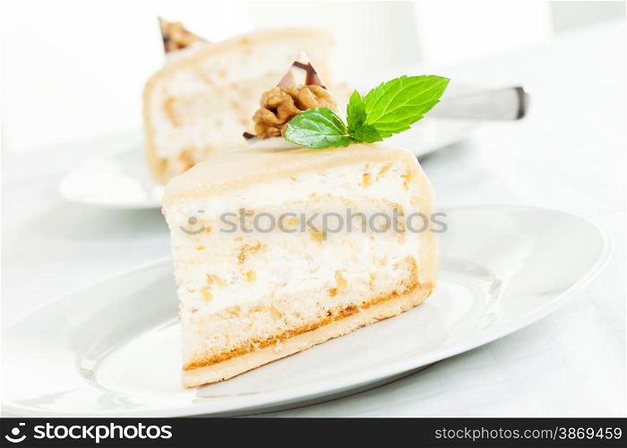 Delicious walnut cream cake with mint leaf