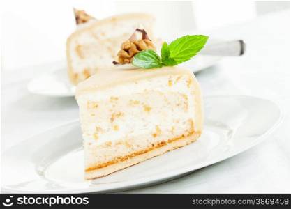 Delicious walnut cream cake with mint leaf