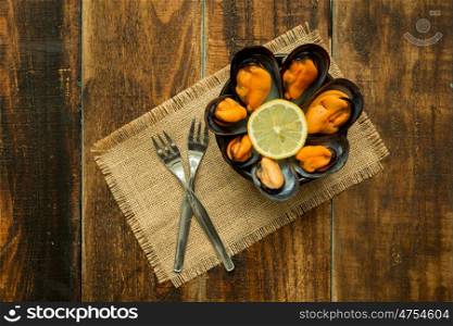 Delicius appetizer with natural mussels and lemon