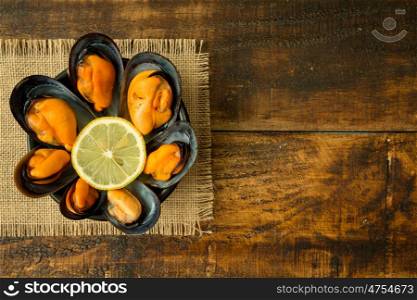Delicius appetizer with natural mussels and lemon