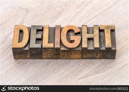 delight word abstract in vintage letterpress wood type