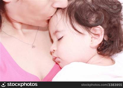 delighted young mother taking care of her adorable baby at home