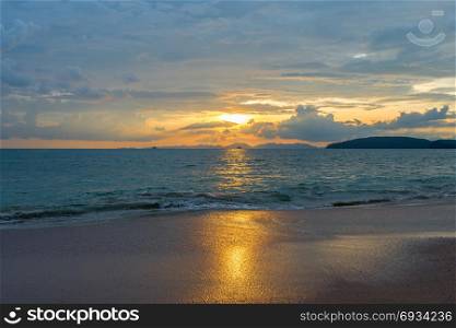delightful sea sunset in orange tones on the coast of Thailand