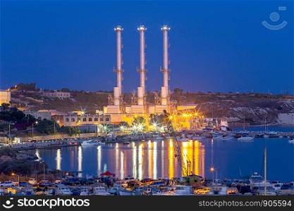 Delimar Power Station in night illumination. Marsaxlokk. Malta.. Marsaxlokk. Delimara main power station at sunset.