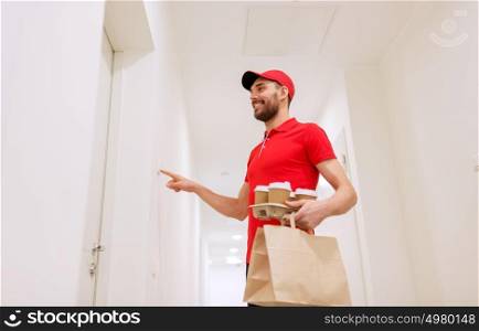 delivery, mail and people concept - happy man delivering coffee and food in disposable paper bag to customer home and ringing doorbell. delivery man with coffee and food ringing doorbell