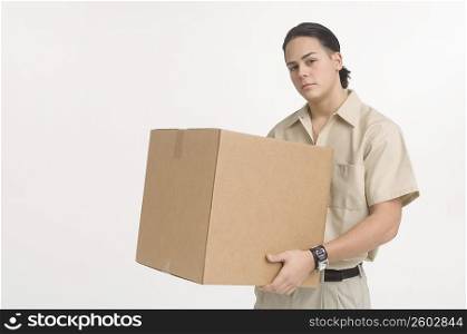 Delivery man carrying large box