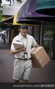 Delivery man carrying large box
