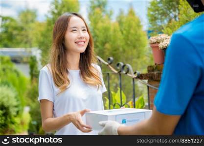Delivery man give medicine drug store to patient female at front home, healthcare medicine online business, Asian woman sick she receive medication first aid pharmacy box hospital delivery service