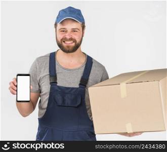 delivery man holding box smartphone with blank screen