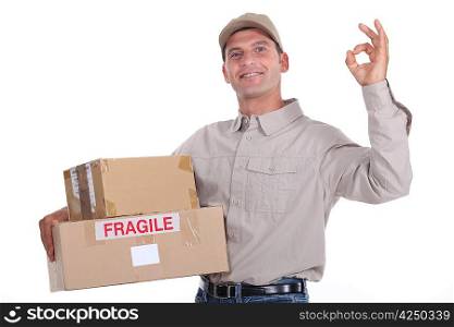 delivery man holding packages and doing the okay sign