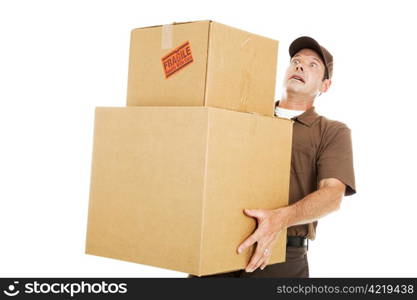 Delivery man or mover about to drop a stack of large boxes. Isolated on white.