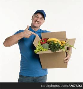 delivery man pointing grocery box