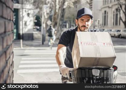 delivery man riding bicycle with parcel