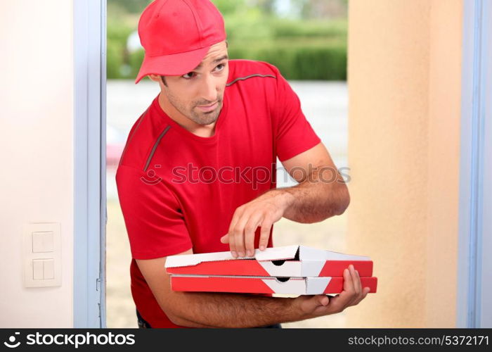 Delivery man with pizza boxes