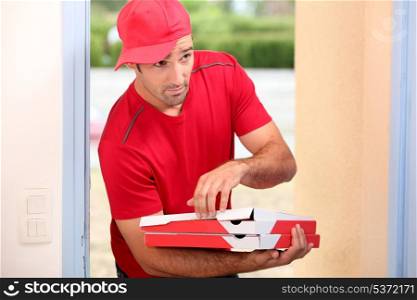 Delivery man with pizza boxes