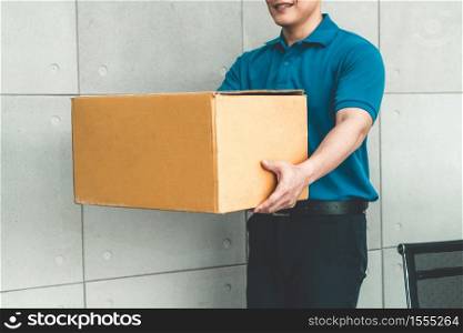 Delivery person carrying parcel box to send to customer . Delivery business concept .