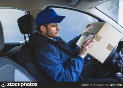 deliveryman checking address parcel